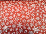 Karácsonyi piros alapon hópehely mintás pamutvászon textil - 160 cm